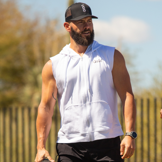 Man wearing Aion oversized zip-up hoodie outdoors under the sun