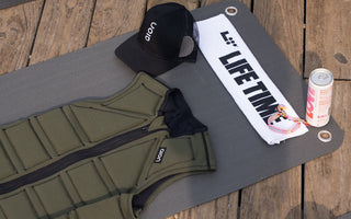 Aion men's weighted vest on a Life Time fitness mat with a Life Time towel and an Aion hat at Life Time MB360 class