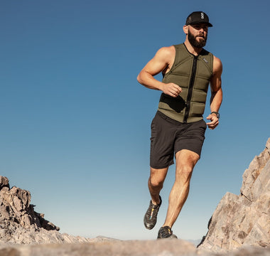 Man running outdoors wearing Limited Edition Aion green men's weighted vest