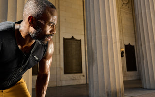 Former Pro Soccer Player Ajay Nwosu (CEO of Teqball USA) wearing the Aion men's weighted vest during a morning weighted vest workout outdoors