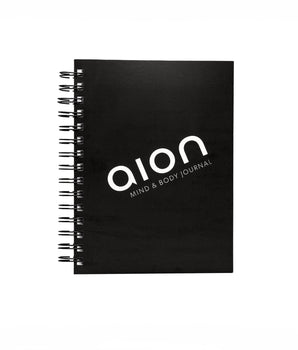 Aion Mind & Body Journal closed on a flat surface